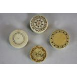 Four 19th century ivory circular gaming counter boxes each containing numbered ivory counters