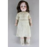 An Armand Marseille bisque head doll market 390n DR.G.M24G/AO1/2M with sleeping eyes and composite