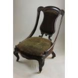 A Victorian nursing chair on cabriole front legs (NC)