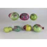 Seven studio pottery pieces of fruit, (some a/f)