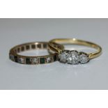 An illusion set diamond three stone ring in platinum and 18ct gold; and a 9ct gold gem set full hoop