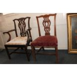 A George III mahogany Chippendale style carver dining chair and a similar single dining chair (NC)