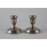 A pair of Continental silver dwarf candlesticks on circular bases, marked 925, 19cm high