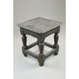 A small 17th century oak stool on turned legs, 32cm (NC)