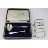 A George V silver cased christening set of spoon and pusher, monogrammed, Sheffield 1930, together