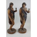 A pair of plaster figures of young men standing on circular pedestals (a/f)  188cm high (NC)