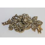 A late 19th century diamond floral spray brooch set throughout with graduated old and rose cut