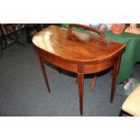 A George III satinwood banded mahogany demi lune card table on square tapered legs, 92cm