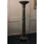 A giltwood and gesso jardiniere stand with fluted column supports, circular base on paw feet,