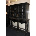 A Victorian copy of a 17th century ebonised cabinet on stand with an arrangement of drawers and