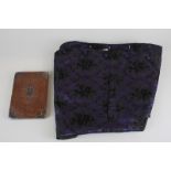 A crocodile wallet, silver mounted, monogrammed and a gentleman's silk waistcoat in purple with