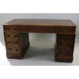 An oak pedestal desk with central drawer and two banks of four drawers, 136cm, (NC)