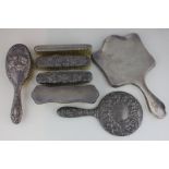 Five various silver dressing table brushes and two silver backed hand mirrors