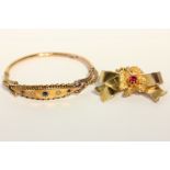 A sapphire and pearl bangle in 9ct gold (af); and a gold brooch set with a red paste