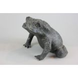 A bronzed metal figure of a toad with dimpled scaled surface, 20cm (NC)