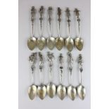 A set of twelve Continental silver teaspoons market 800, the handles modelled as musicians from an