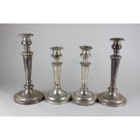 Two pairs of silver plated candlesticks with gadroon borders and plain tapered stems, 29cm and