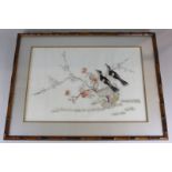 Two Chinese embroidered silk pictures of exotic birds amongst branches of blossom, bamboo frames,