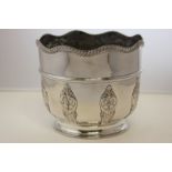 A silver plated planter with scalloped gadroon border, 17cm high