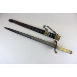 A Continental short sword with 16 inch engraved blade, spiral carved handle, in gilt metal mounted