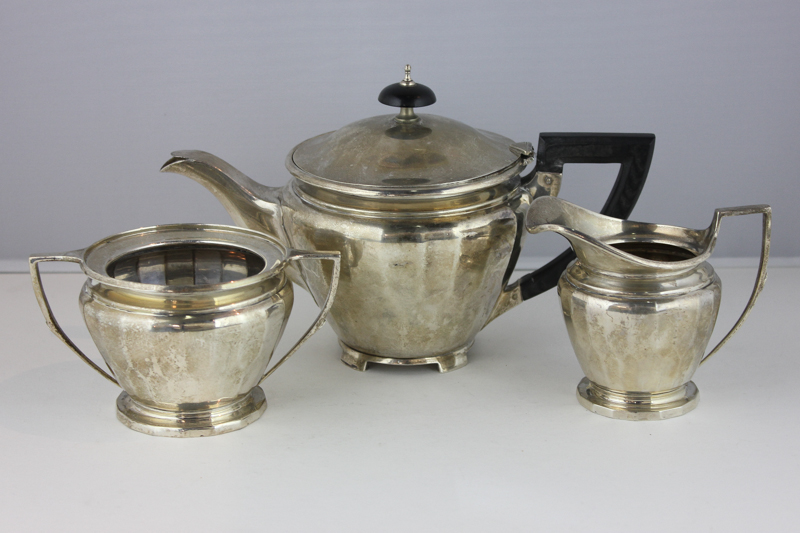 A George VI silver three piece tea set maker G Mills and Co Birmingham 1946, with circular bodies,
