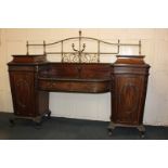 A 20th century mahogany sideboard of 'Chippendale' style with two centre drawers flanked by