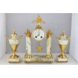 A Louis XVI style ormolu and marble mantel clock garniture, the clock in gilt case on marble and