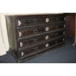 A large early 18th century chest of four long drawers with applied moulded edges and bone inlaid