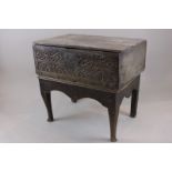 An early 17th century and later oak box with hinged top on later  stand 76cm (NC)