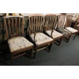 Five George III mahogany dining chairs with lath backs and lift-out seats (including one carver) (