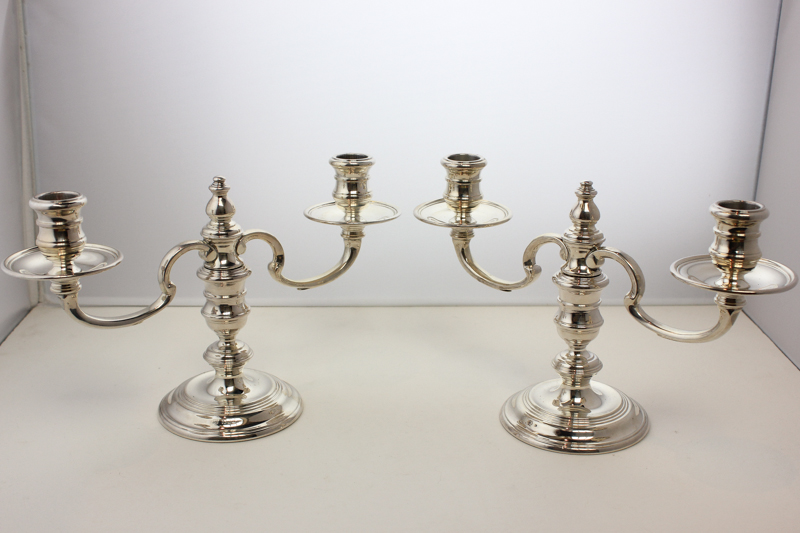 A pair of modern silver two branch candelabra, London 1972, weighted, ,17cm tall