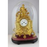 A French brass ormolu mantel clock surmounted with a figure of a fisherman hauling in a net, with