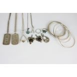 Two silver ingot pendants on chains, a heavy silver bangle, a silver wishbone pendant on chain and