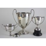 A George V silver trophy cup, Sheffield 1913, together with two other silver trophy cups (one a/