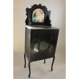 A Victorian ebonised cabinet with raised mirror back and single fretwork glazed door, 56cm, (NC)