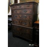 An early 18th century walnut chest on chest (reduced in height) with three short and five long