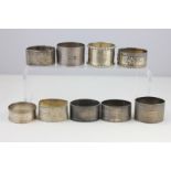 Nine Victorian and later silver napkin rings, various dates and makers, 7oz