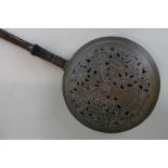 An 18th century pierced brass warming pan (NC)