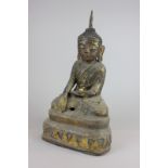 A gilt decorated figure of a seated Buddha, possibly from Thailand, 46cm high, (NC)