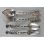 A Victorian silver matched christening set with leaf and scroll decorated trefoil handles, fork