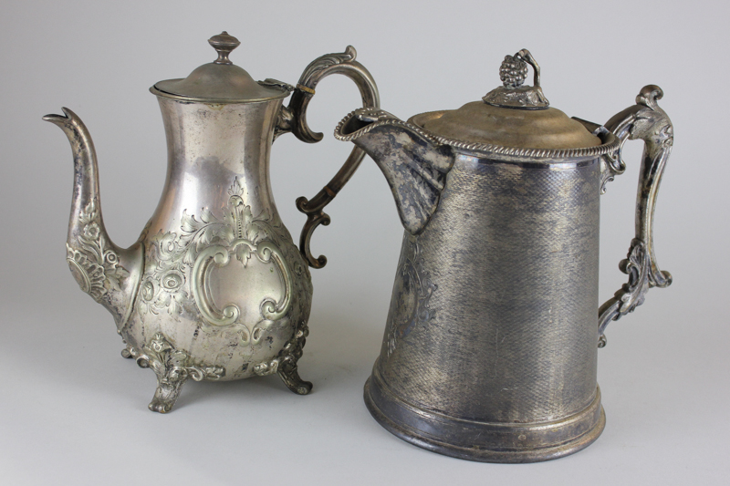 A heavy Victorian silver plated hot water jug with scroll handle and finial, modelled as a bunch