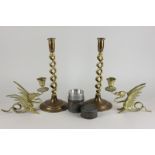 A pair of brass candlesticks, 30.5cm high, with candy twist stems, two dragon shaped candlesticks