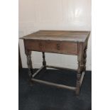 A 17th century rectangular oak side table with single drawer, teardrop handles, on turned supports