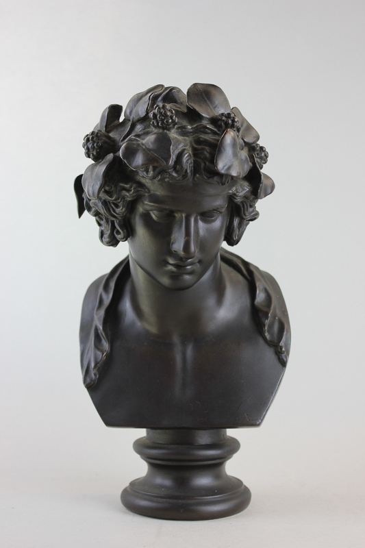 A 20th century bronze bust of 'Dionysus' (god of wine), with fruit and leaves in his hair on