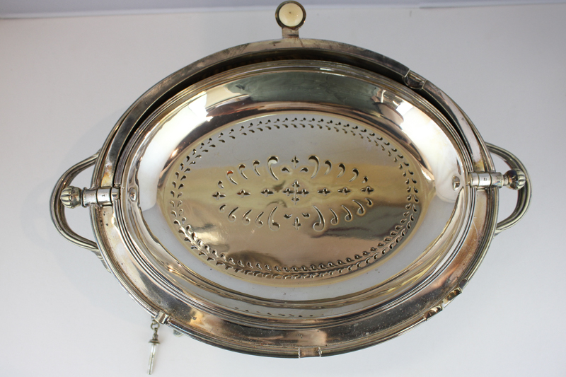 A silver plated revolving oval breakfast dish with strainer and locking pin on four reeded curved - Image 2 of 2