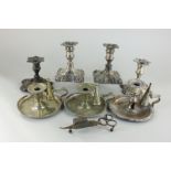 Two pairs of silver plated dwarf candlesticks, a pair of chambersticks, a single chamberstick and