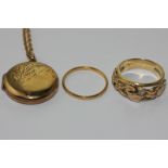 An 18ct gold ring floral pierced, makers mark C. st D.,  5.5g; a 22ct wedding ring, 1g; a 9ct gold