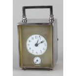 A late 19th, early 20th century French small silver collared metal cased carriage clock, stamped