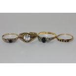 Three sapphire and diamond rings and a white sapphire ring in 9ct gold