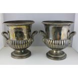A pair of silver plated campana shaped ice buckets with armorial stamp, 24cm high